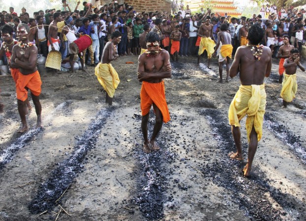 Representative Image of devotee walking on burning coal as they perform a ritual firewalking