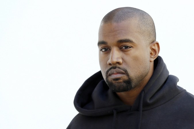American rapper Kanye West poses before Christian Dior 2015-2016 fall/winter ready-to-wear collection fashion show on March 6, 2015 in Paris Kanye West