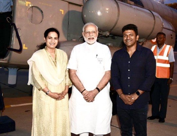 Narendra Modi with Puneeth Rajkumar and his wife Ashwini. Narendra Modi with Puneeth Rajkumar and his wife