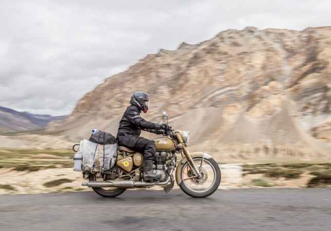 A rider riding Royal Enfield Classic 500 on the roads to the Himalayas. Royal Enfield Himalayan Odyssey 2018