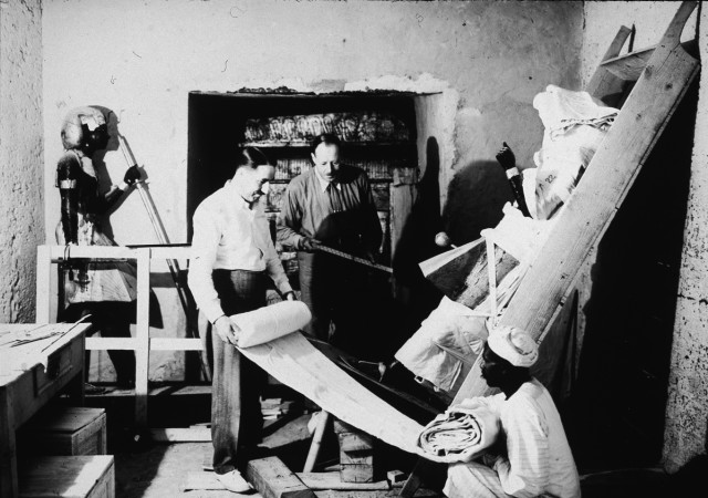 British archaeologists Howard Carter (left) and Arthur Callender carry out the systematic removal of objects from the antechamber of the tomb of Pharaoh Tutankhamen, better known as King Tut, with the assistance of an Egyptian laborer, Valley of the Kings, Thebes, Egypt, 1923 excavation of Tut's tomb