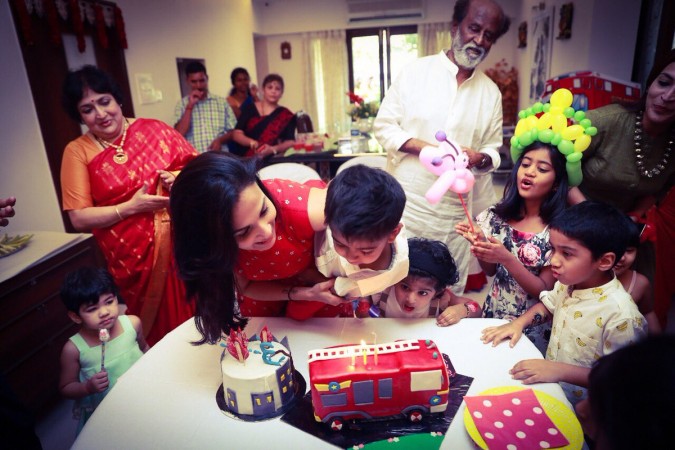 Soundarya Rajinikanth's son Veda Krishna cuts cake. Latha, Rajinikanth and Aishwarya Dhanush are seen in the picture. Soundarya Rajinikanth's Son Veda Krishna Birthday Celebration