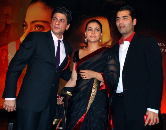 Shahrukh Khan (L), Kajol (C) and director Karan Johar (R) pose during a first look screening for the movie 'My Name is Khan' in Mumbai on December 16, 2009. Shah Rukh Khan, Kajol and Karan Johar