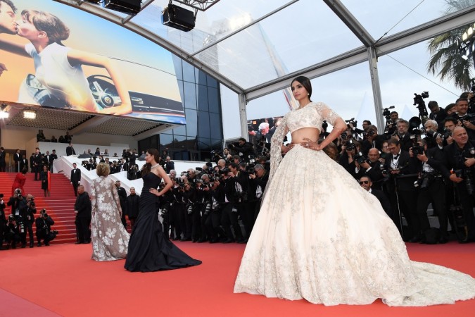 Sonam Kapoor and Mahira Khan pose as they arrive for the screening of the film 'BlacKkKlansman' at the 71st edition of the Cannes Film Festival in Cannes, southern France. Sonam Kapoor and Mahira Khan
