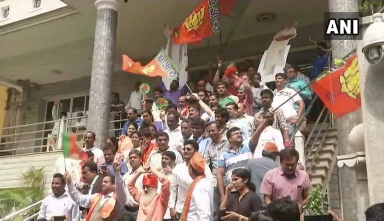 BJP workers celebrate outside party office in Bengaluru. KARNATAKA ASSEMBLY ELECTIONS