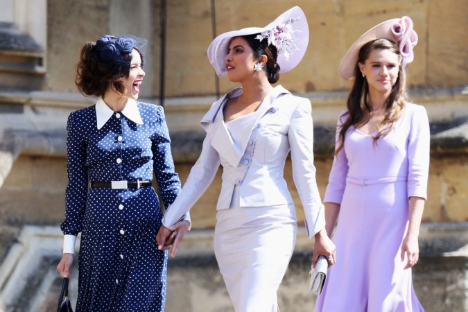 (L-R) Abigail Spencer and Priyanka Chopra arrive at the wedding of Prince Harry to Ms Meghan Markle at St George's Chapel, Windsor Castle on May 19, 2018 in Windsor, England Abigail Spencer and Priyanka Chopra
