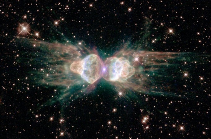The Ant Nebula, as imaged by the Hubble Space Telescope, resembles the head and body of a garden ant, in reality, it is the result of a dying Sun-like star and complex interactions of material at its heart Ant Nebula