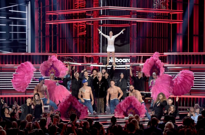 Host Kelly Clarkson (C) performs onstage during the 2018 Billboard Music Awards at MGM Grand Garden Arena on May 20, 2018 in Las Vegas, Nevada. 2018 Billboard Music Awards