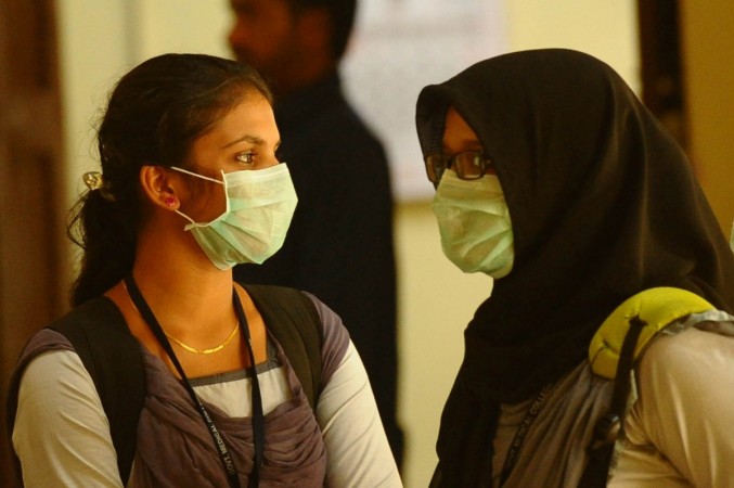 Students wear safety masks as a precautionary measure after the outbreak of 'Nipah' virus in Kozhikode, Kerala on May 22, 2018. Nipah Kerala