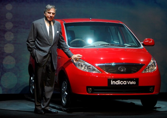 Former Tata Motors Chairman Ratan Tata poses with the company's new Ratan Tata, Tata Indica