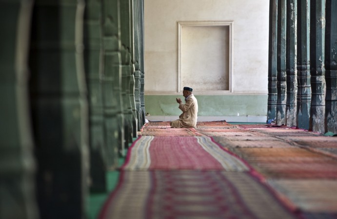 A Ugyhur Muslim worshiper prays inside the Kashgar Idgah mosque A Ugyhur Muslim worshiper prays inside the Kashgar Idgah mosque