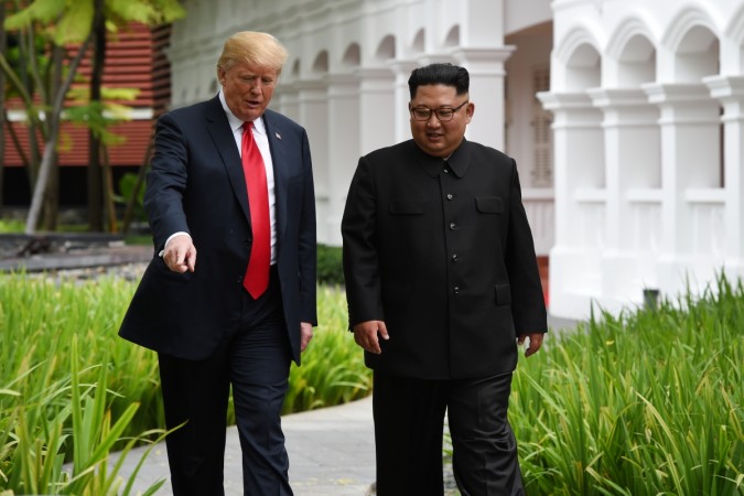 Donald Trump and North Korean leader Kim Jong Un walk in the Capella Hotel after their working lunch Donald Trump Kim Jong Un