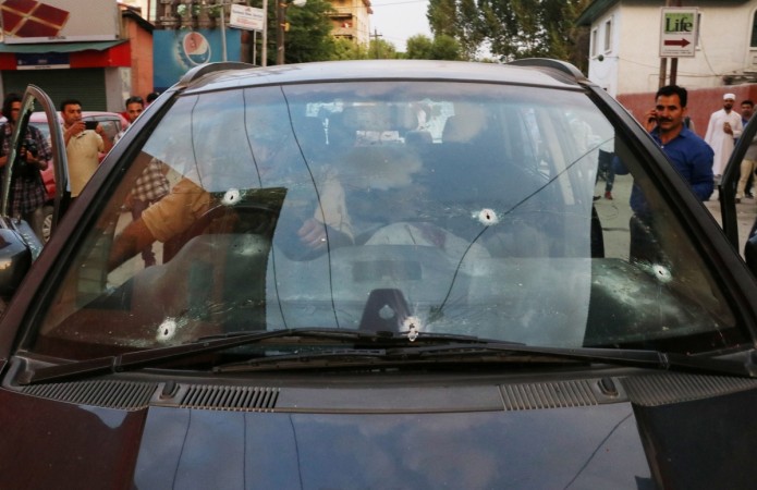 Bullet marks are seen on the car of Syed Shujaat Bukhari, the editor of Rising Kashmir daily newspaper, after unidentified gunmen attacked him outside his office in Srinagar, June 14, 2018. Shujaat Bukhari