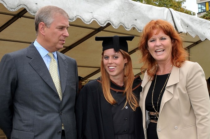 Princess Beatrice (C) poses for a photograph with her parents, Britain's Prince Andrew, the Duke York (L) and Sarah Ferguson following her graduation ceremony at Goldsmiths College, in London, on September 9, 2011. Prince Andrew, Princess Beatrice and Sarah Ferguson