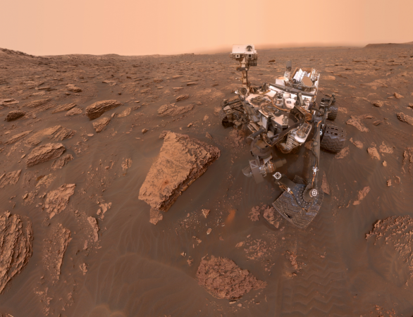 A self-portrait by NASA's Curiosity rover taken on Sol 2082 (June 15, 2018). A Martian dust storm has reduced sunlight and visibility at the rover's location in Gale Crater. A drill hole can be seen in the rock to the left of the rover at a target site called Curiosity Rover