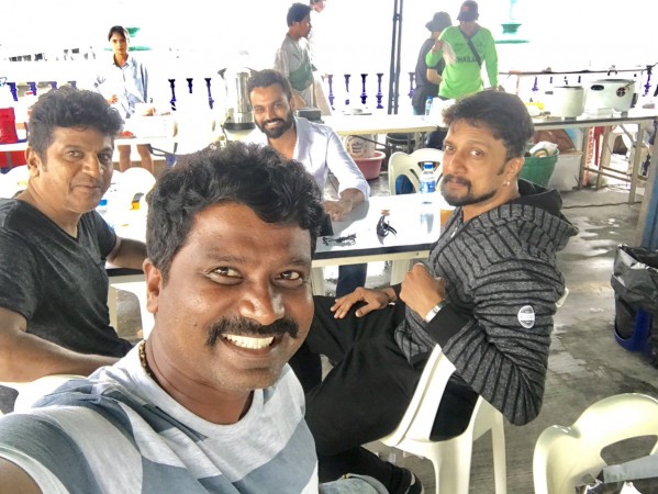 Shivaraj Kumar, Sudeep, Thilak and Prem are seen on the sets of upcoming Kannada movie The Villain. Shivaraj Kumar, Sudeep, Thilak and Prem on The Villain Sets