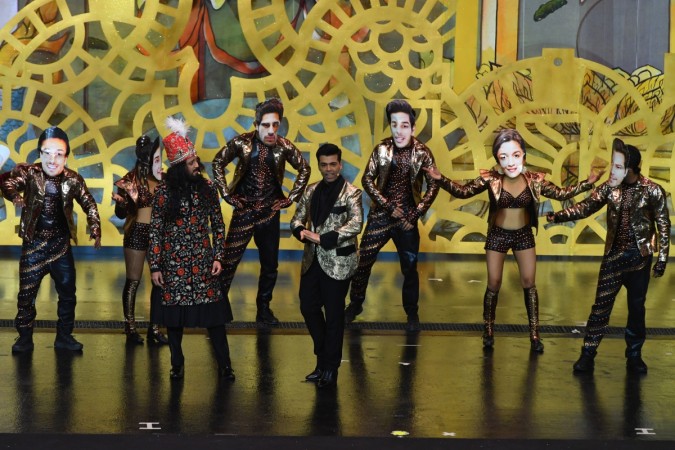Bollywood actor Ritesh Deshmukh (L) and director/producer Karan Johar (R) host the IIFA Awards of the 19th International Indian Film Academy (IIFA) festival at the Siam Niramit Theatre in Bangkok on June 24, 2018. Karan Johar and Riteish Deshmukh