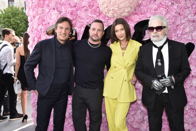 (L-R) Pietro Beccari, Kim Jones, Bella Hadid and Karl Lagerfeld attend the Dior Homme Menswear Spring/Summer 2019 show as part of Paris Fashion Week on June 23, 2018 in Paris, France. Bella Hadid