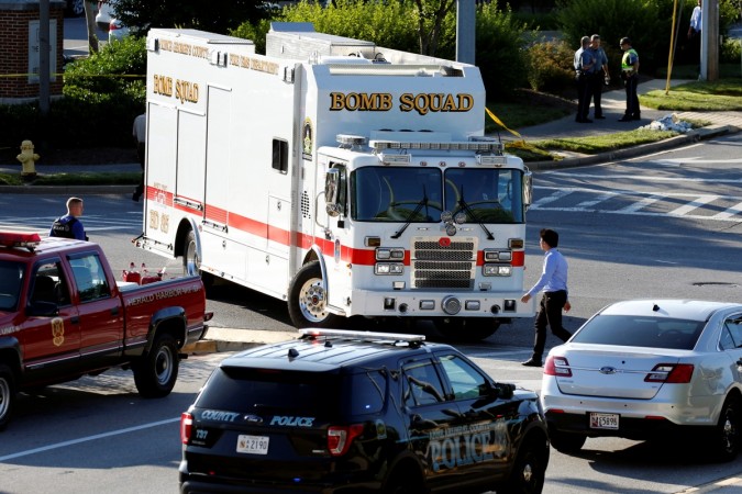 Emergency response vehicles drive near a shooting scene after a gunman opened fire at the Capital Gazette newspaper in Annapolis, Maryland, U.S., June 28, 2018 Maryland shooting