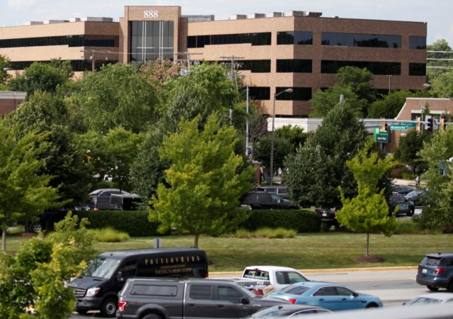 Police gather near the Capital Gazette newspaper office where 5 people were shot dead Maryland shooting