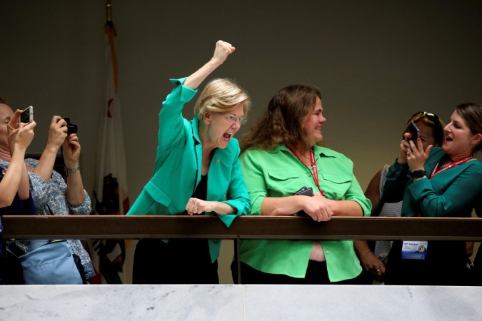 U.S. Senator Elizabeth Warren (D-MA) cheers on demonstrators opposing the immigration policies of the Trump administration, as they are arrested at the Hart Senate Office Building on Capitol Hill in Washington, on June 28, 2018. US senator cheers on protestors at anti-Trump rally at the Capitol