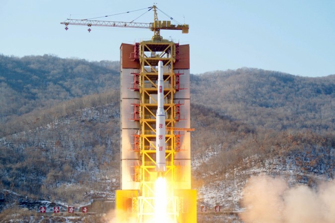 FILE PHOTO: A North Korean long-range rocket is launched into the air at the Sohae rocket launch site, North Korea, in this photo released by Kyodo North Korean missile