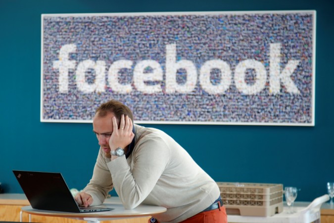 A visitor works on his computer at France's Facebook headquarters in Paris, France, May 15, 2018. Facebook