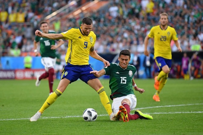 Hector Moreno (R) will miss the game against Brazil through suspension Hector Moreno Mexico Sweden