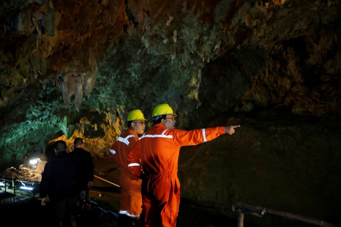 Soldiers and rescue workers work in Tham Luang cave complex, as an ongoing search for members of an under-16 soccer team and their coach continues, in the northern province of Chiang Rai, Thailand Soldiers and rescue workers work in Tham Luang cave complex