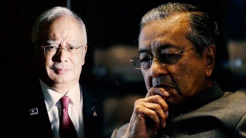 Former Malaysian prime minister Najib Razak (left) and his mentor-turned-foe, Prime Minister Mahathir Mohamad. Former Malaysian prime minister Najib Razak arrested