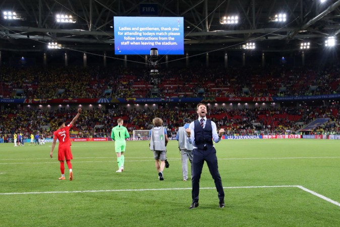 England coach Gareth Southgate celebrates with the team after their win on Tuesday. Gareth Southgate
