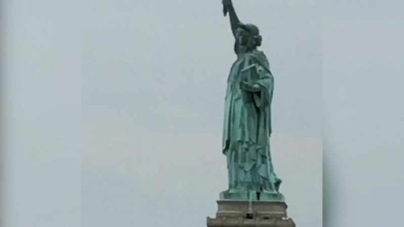 Woman Scales Statue Of Liberty On Fourth Of July Woman Scales Statue Of Liberty On Fourth Of July