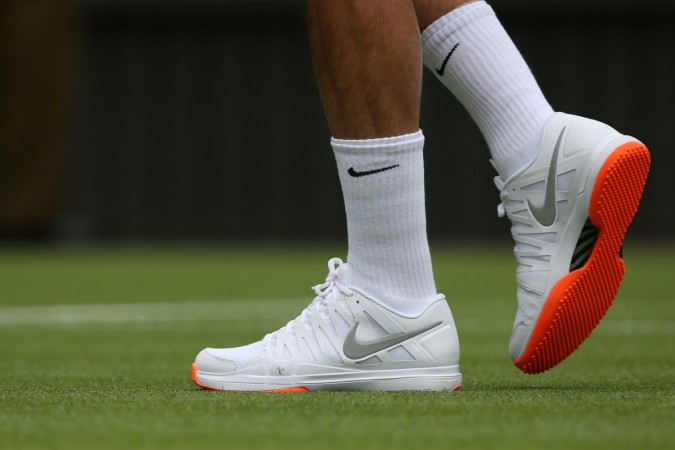 Roger Federer was told not to wear orange-sole shoes at Wimbledon 2013. Roger Federer