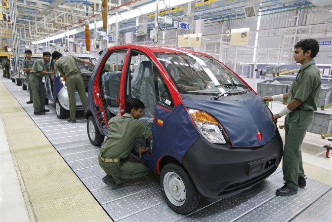 Employees work inside the newly inaugurated plant for the Tata Nano car at Sanand in the western Indian state of Gujarat June 2, 2010. India's largest vehicle maker, Tata Motors, said on Tuesday its sales in May rose 41 percent from a year earlier to 56,779 units. Tata Nano at manufacturing plant in Gujarat