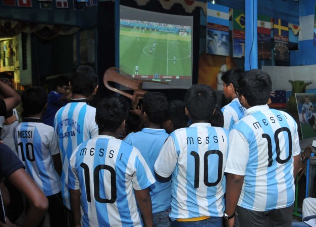 Argentina and Lionel Messi fans watch on a screen the FIFA 2018 World Cup last 16 football match between Argentina and France, in Kolkata. Kolkata Fifa World Cup 2018
