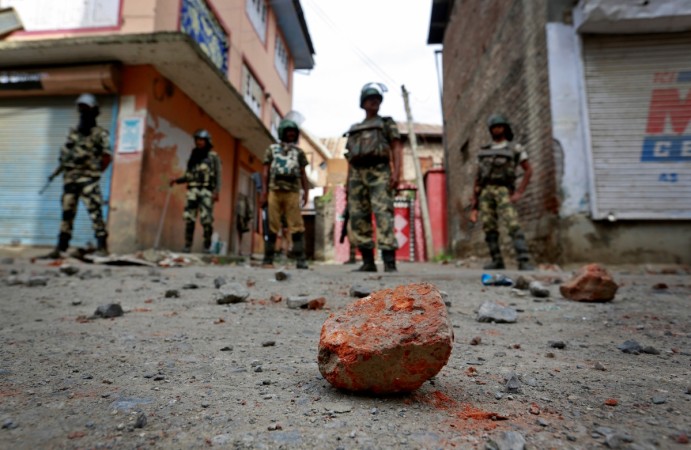 Stones thrown by protestors litter the street in Srinagar as security forces enforce a curfew following weeks of violence in Kashmir, August 18, 2016. Stone pelting in Srinagar, Kashmir