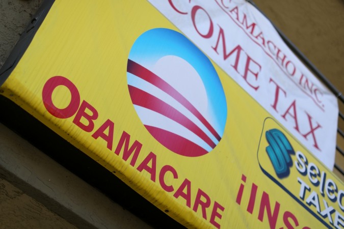 A sign on an insurance store advertises Obamacare in San Ysidro, San Diego, California, A sign on an insurance store advertises Obamacare in San Ysidro, San Diego, California,