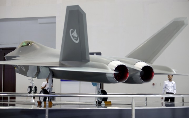 Visitors look at a model of J-31 stealth fighter at Aviation Industry Corporation of China (AVIC)'s booth at the Aviation Expo China 2015, in Beijing, China, September 16, 2015. China's stealth fighter aircraft J-31