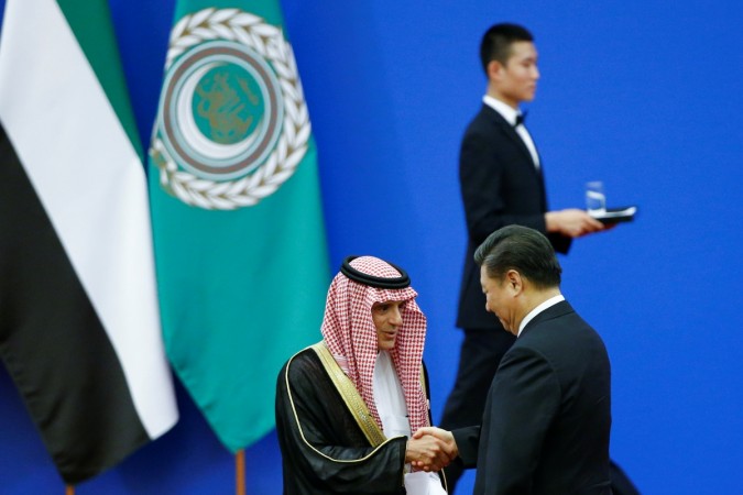 Chinese President Xi Jinping and Saudi Arabia's Foreign Minister Adel bin Ahmed Al-Jubeir shake hands at a China Arab forum at the Great Hall of the People in Beijing, China, July 10, 2018. CHina Arab forum