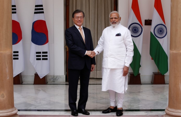 South Korean President Moon Jae-in shakes hands with India's Prime Minister Narendra Modi during a photo opportunity ahead of their meeting at Hyderabad House in New Delhi Moon Jae-in shakes hands with Narendra Modi