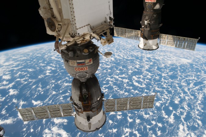 Progress 66 cargo craft are pictured as the International Space Station orbits about 250 miles above Earth Progress cargo pod