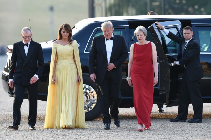 US President Donald Trump (2R) and US First Lady Melania Trump (2L) are welcomed by Britain's Prime Minister Theresa May (R) and her husband Philip May (L) as they arrive for a black-tie dinner with business leaders at Blenheim Palace, west of London, on July 12, 2018, on the first day of President Trump's visit to the UK. Melania Trump dresses