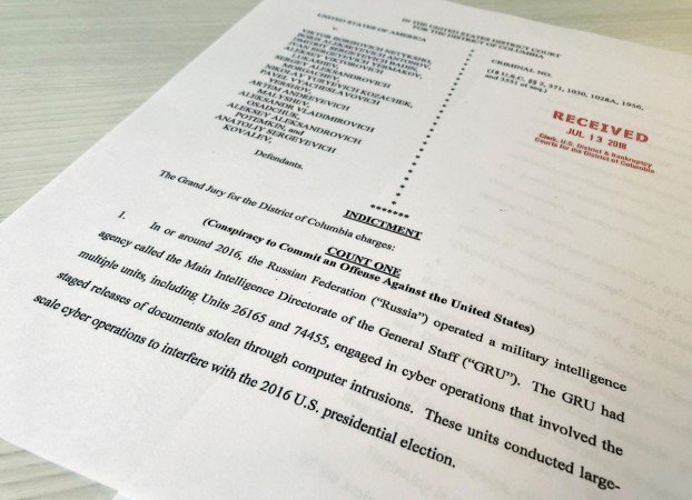 A copy of the grand jury indictment against 12 Russian intelligence officers is seen after the indictments were filed in U.S. District Court by prosecutors working as part of special counsel Robert Mueller's Russia investigationÊin Washington A copy of the grand jury indictment against 12 Russian intelligence officers