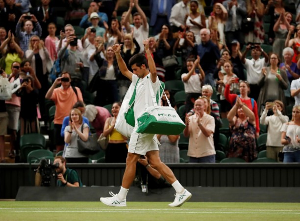 Serbia's Novak Djokovic as he walks off court after his semi final match against Spain's Rafael Nadal was stopped due to the time Novak Djokovic walks off the court