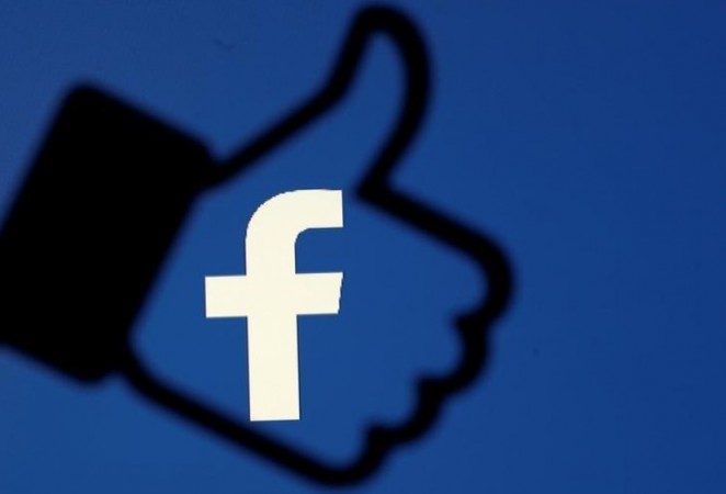 A 3D-printed Facebook like button is seen in front of the Facebook logo, in this illustration taken October 25, 2017 Facebook tourist and guide algorithms