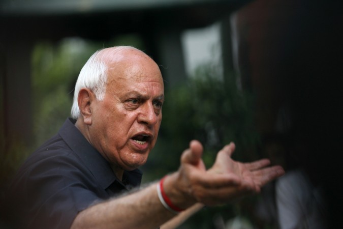 Former Chief Minister of Kashmir Farooq Abdullah talks to the media after a meeting with Congress Party chief Sonia Gandhi. Farooq Abdullah