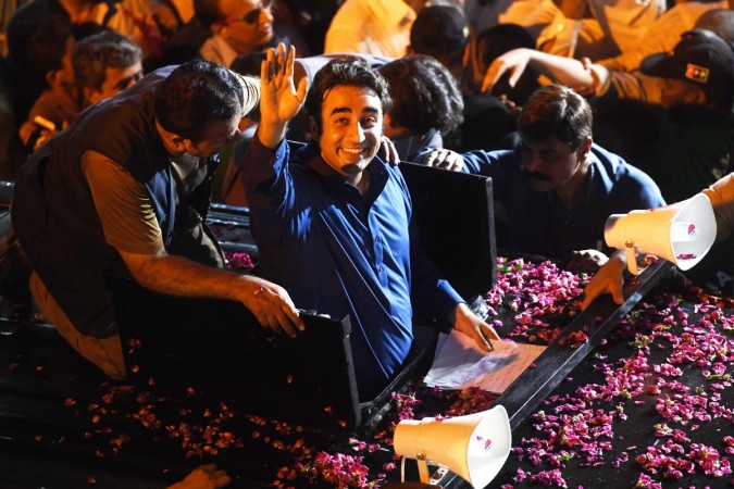 Pakistan Peoples Party (PPP) Chairman Bilawal Bhutto (C) waves to supporters during an election campaign rally in Karachi Bilawal Zardari Bhutto