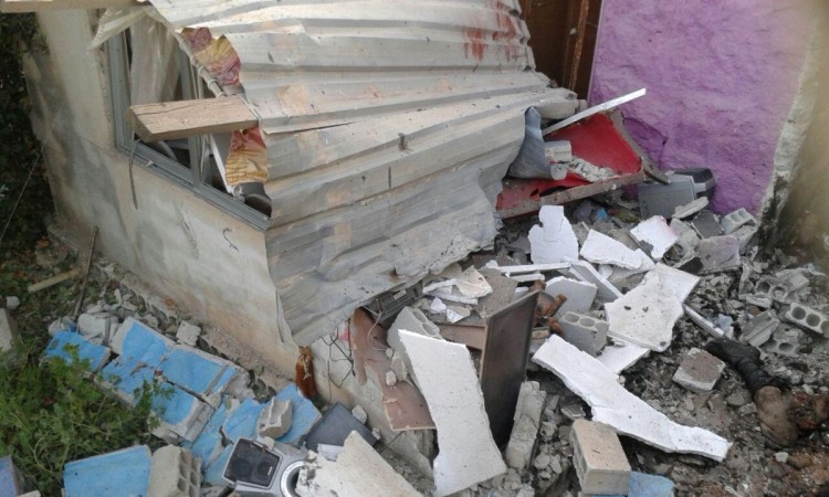 Damages and a body part are seen after suicide bomb attack in Sweida, Syria July 25, 2018. amages and a body part are seen after suicide bomb attack in Sweida, Syria