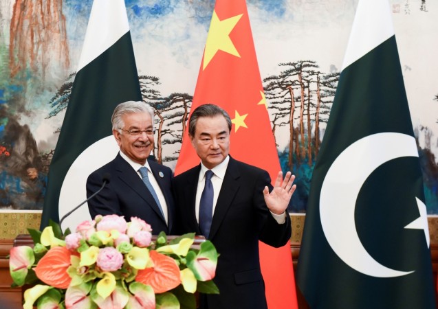 Pakistan's Foreign Minister Khawaja Muhammad Asif (left) and Chinese State Councilor and Foreign Minister Wang Yi (right) after their press conference at the Diaoyutai State Guest House in Beijing, China, April 23, 2018. Pakistan China