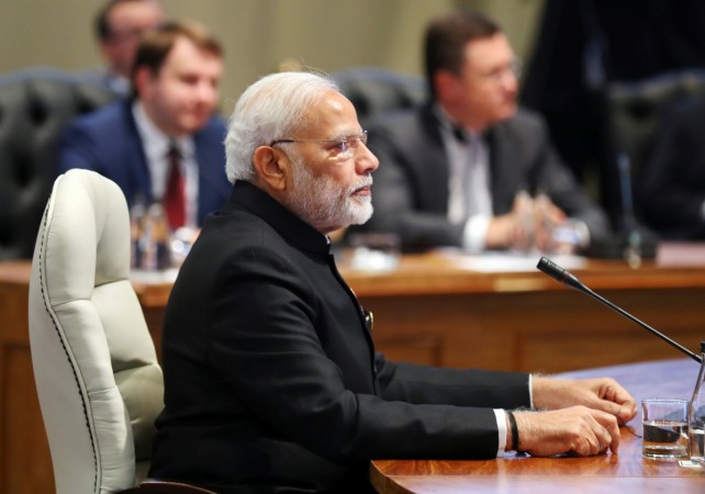 Indian Prime Minister Narendra Modi takes his seat at the first closed session of the leaders of the BRICS summit meeting in Johannesburg, South Africa, July 26, 2018 Narendra Modi at BRICS 2018
